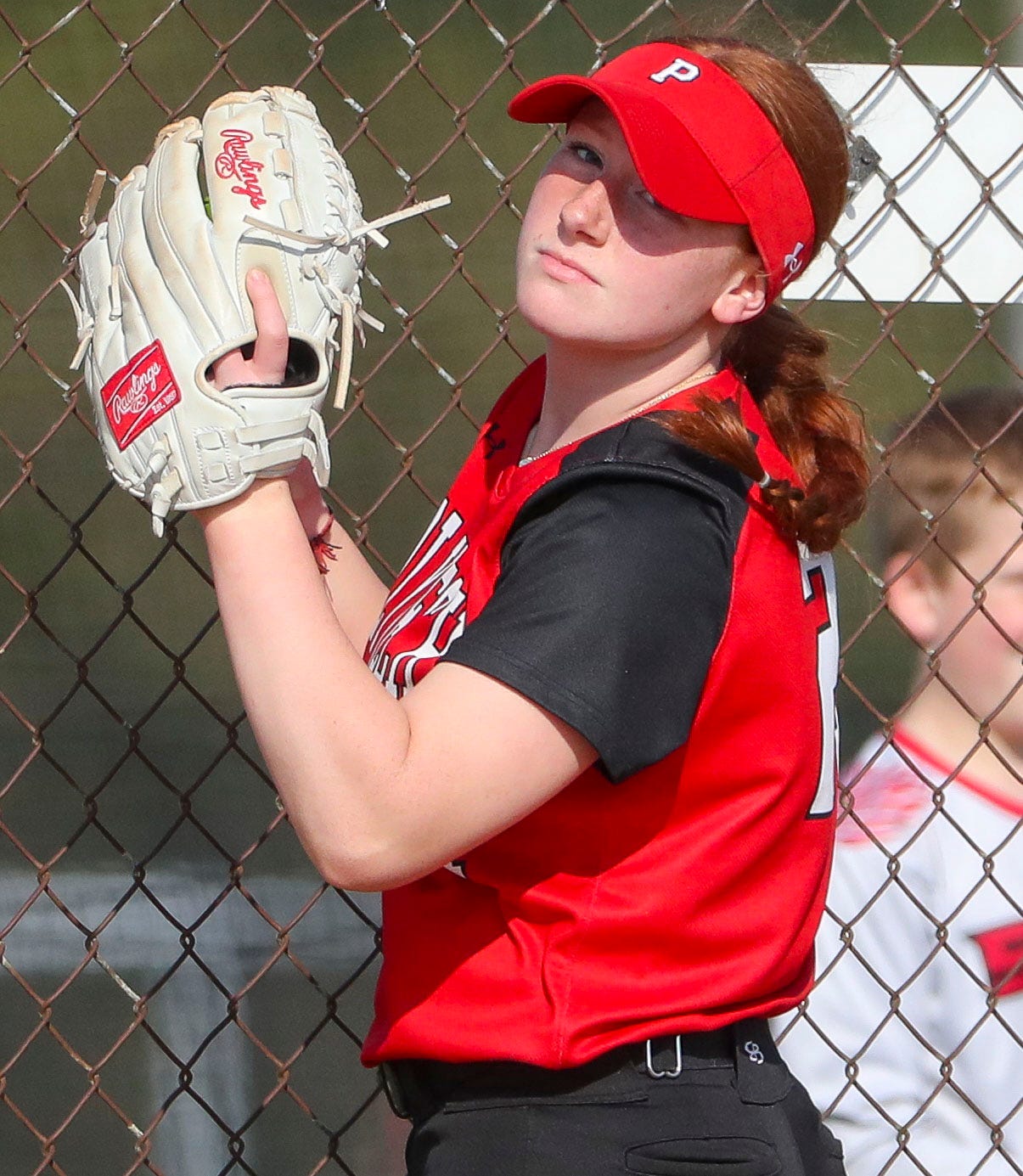 Polytech's Gabrielle Bogdon checks the runner after making catch in foul territory in the third inning of Polytech's 8-3 win at Smyrna High School, Thursday, April 18, 2024.
