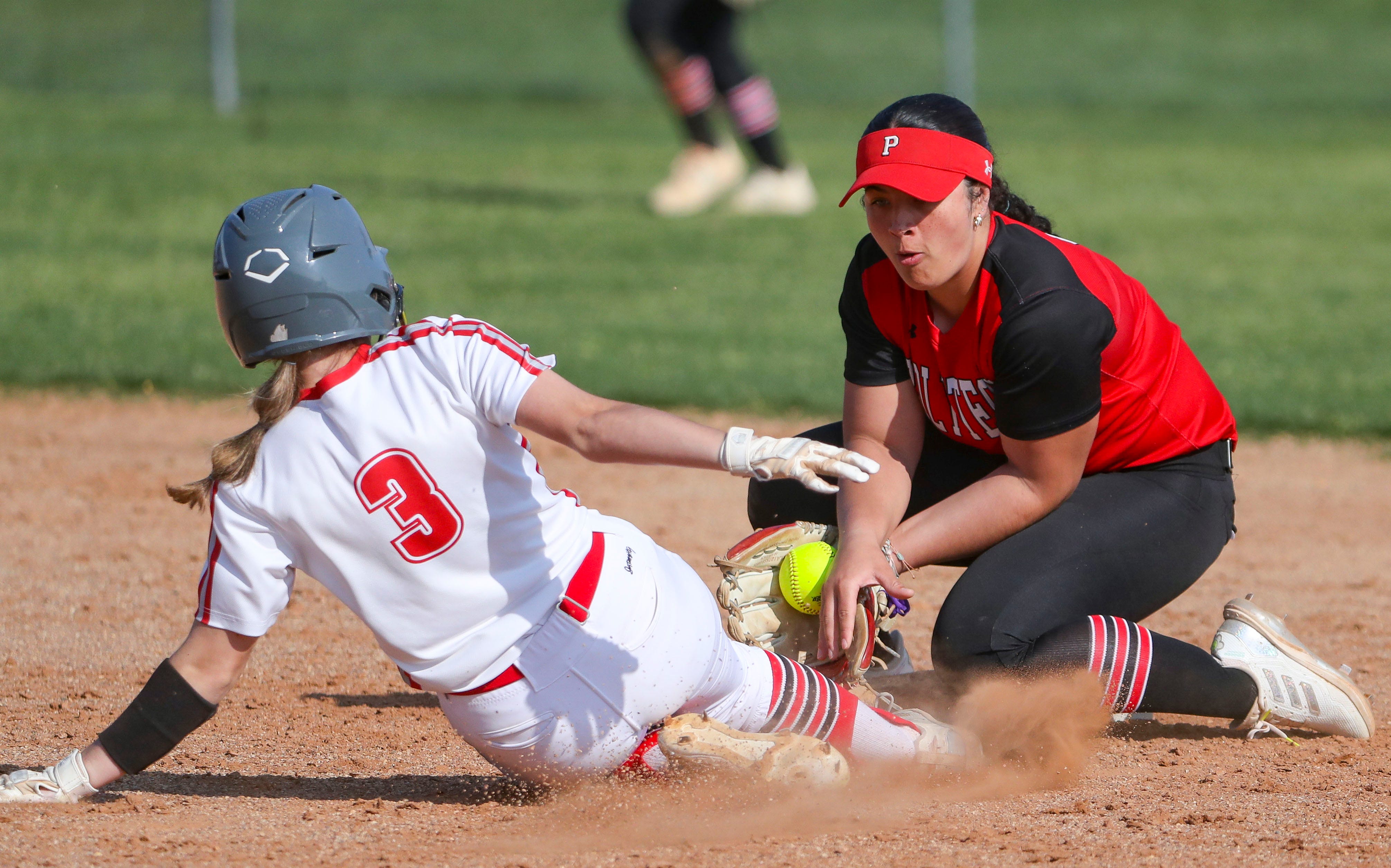 Smyrna's Kennedy Diehl is safe at second on a third inning steal as Polytech's Kha'Lyn Tilghman puts on the tag in Polytech's 8-3 win at Smyrna High School, Thursday, April 18, 2024.