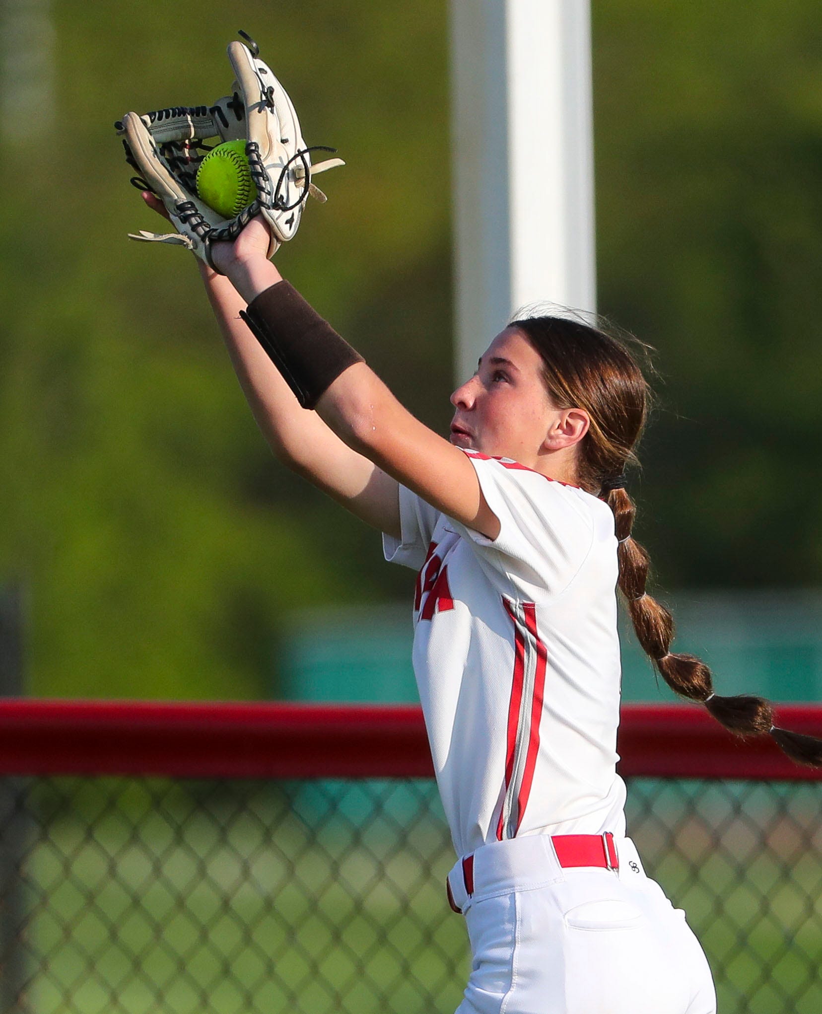 Smyrna's Kaitlyn Slaney ends the Polytech half of the seventh inning with a catch deep in centerfield in Polytech's 8-3 win at Smyrna High School, Thursday, April 18, 2024.