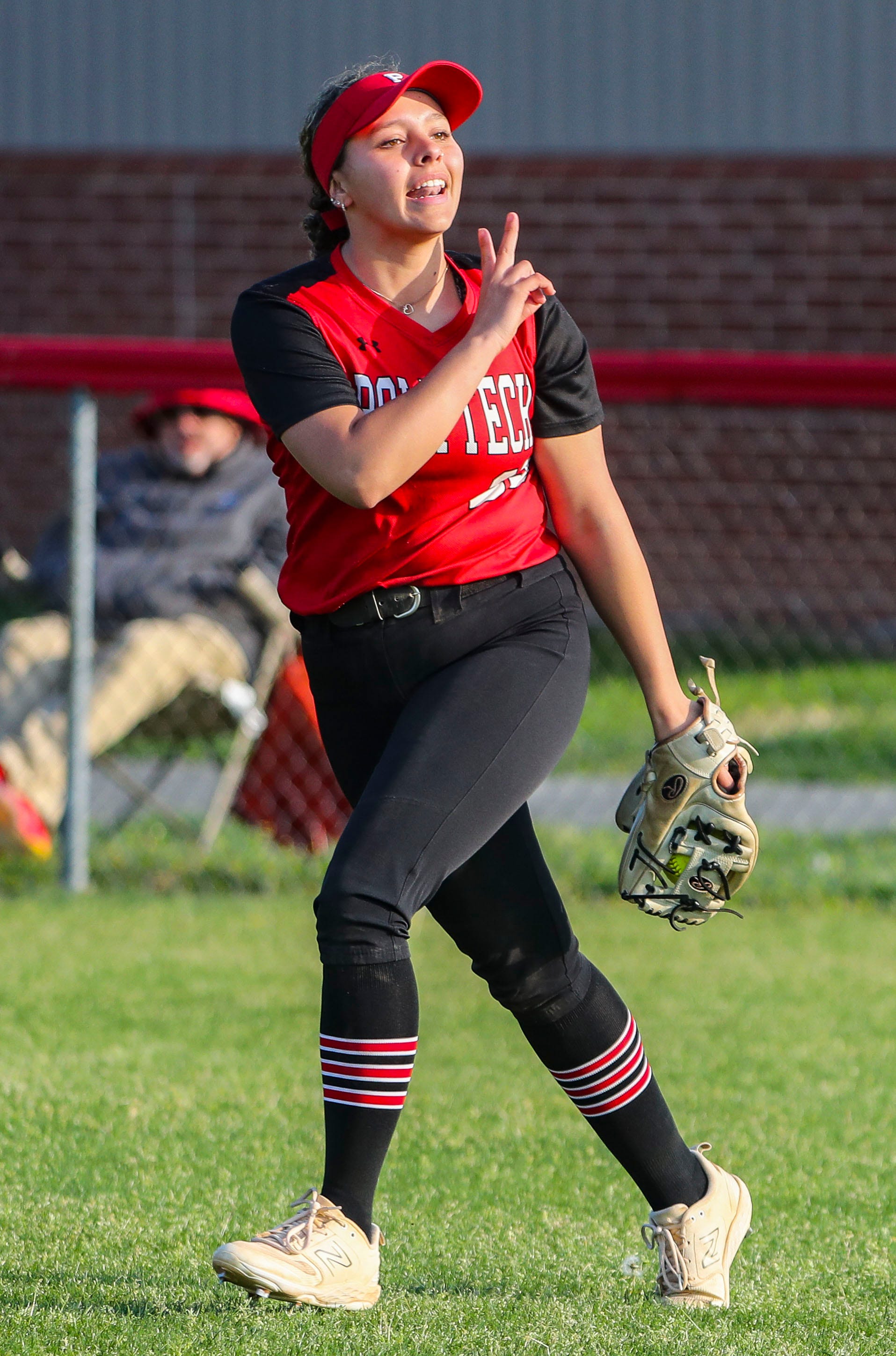 Polytech's Kyla Davis gestures after making a catch for the final out in Polytech's 8-3 win at Smyrna High School, Thursday, April 18, 2024.